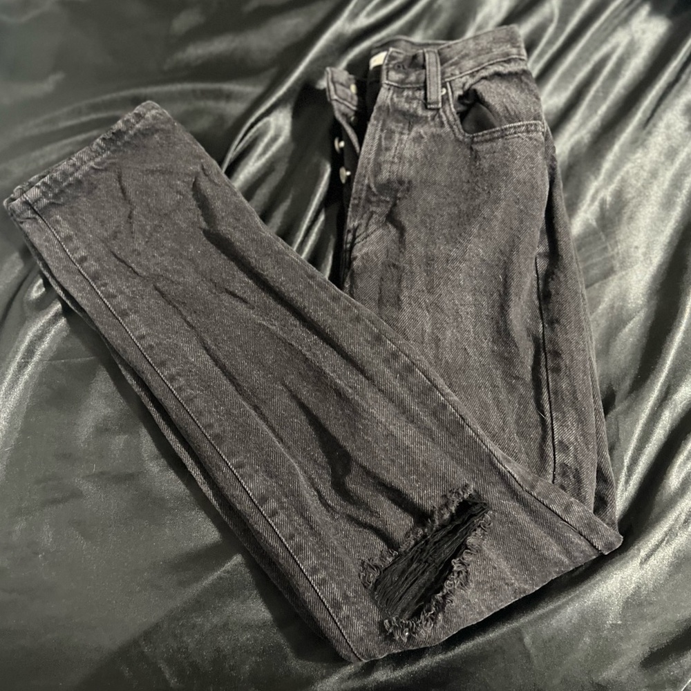 Black Dad Jeans, ripped at the knee. Straight leg